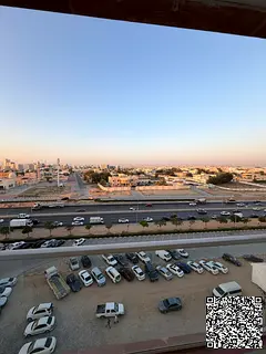Two-bedroom apartment with a living room and an open view overlooking Sheikh Khalifa Street.
