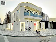 The most luxurious and elegant villa in Ajman, including fees and registration, two floors and a roo