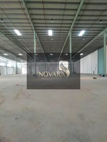 Warehouses for rent in Umm Al Quwain with large areas, AED 30 per sq ft, ideal for storage purposes, practical location.