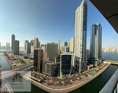 Apartment with a distinctive view of Al Qasba Canal, Khalid Lake, and Al Khan Lake, offering a stunn