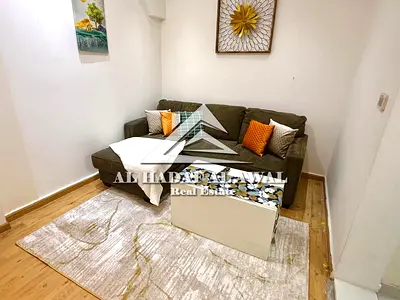 Studio apartment for rent, divided into a room and a living room.