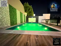 Luxury villa for sale in Al Muwaihat, Ajman, with a swimming pool, price includes electricity, water