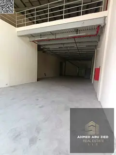 Warehouse for annual rent in Al Jurf 2 - with a large additional mezzanine area - equipped with a hi