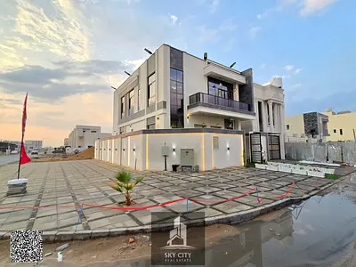 European villa, corner location on two streets, on a main street, close to Emirates Road. Includes registration fees, 5 rooms, personal finishing, central air conditioning, freehold ownership and no f