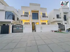 Villa for sale in Al Helio, Ajman. Includes registration fees, electricity, and water. 5 master bedr