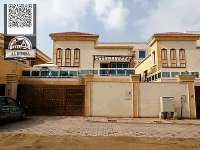 For sale - Luxury villa in Al Muwaihat 2, Ajman | Area: 5000 sq ft | 6 master bedrooms + maid's room | Majlis and 2 halls, including water, electricit