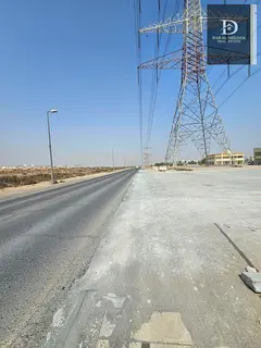 For Sale in Sharjah Al Dabdaba North Commercial Land, Prime Location On a 54-meter Street Opposite A