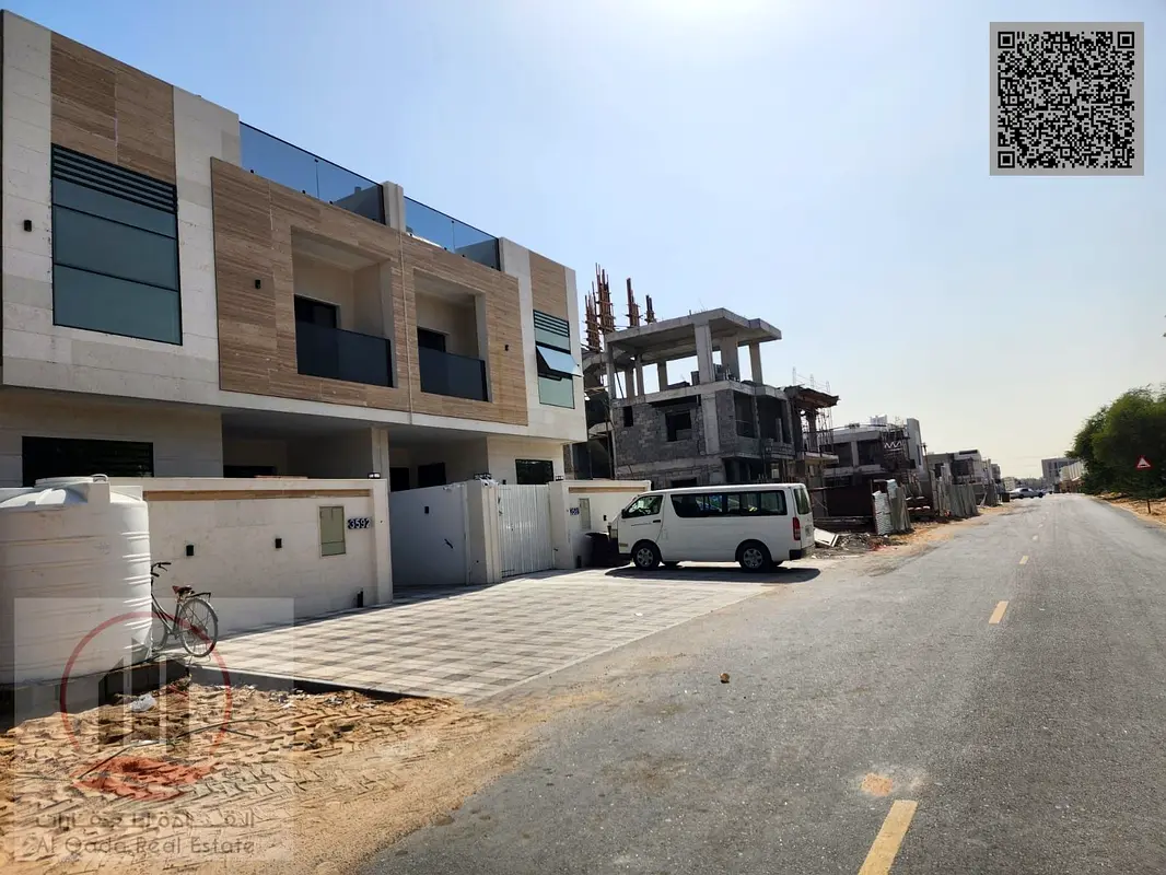 Villa for sale in Ajman, Al Helio area, including registration. Features include master bedrooms, a majlis (formal sitting room), a living room, and a