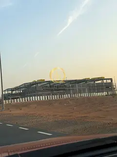 Industrial land for sale in Al-Qasimia. The land area is 12,000 sq. ft. and the price per sq. ft. is
