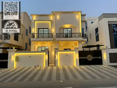 For SALE a villa in Al Helio 2 in Ajman, 6 master bedrooms, a majlis, a hall, a maid's room, and a store