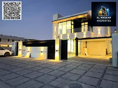Luxury villa with a modern design, 5000 sq ft, with a garden, behind Ajman Academy. Price includes a