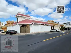 Corner villa for sale in Al Rawda 3, Ajman, including electricity, water, and air conditioning. The