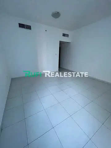 A room and a living room in Falcon Towers with a distinctive area and an excellent location in the heart of Ajman, plus a beautiful view