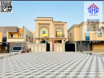 For sale, a ground floor villa + two floors, stone facade with a 25-meter setback, 7 master bedrooms, a majlis with 2 halls and a maid's room