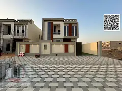 Villa for sale in Ajman, Al Helio 2 area. The villa includes registration fees (4 master bedrooms + 