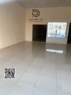 Shop for rent in Ajman Industrial Area, prime and strategic location on a main road, surrounded by s