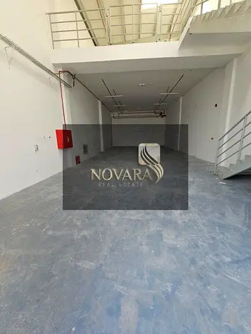 A distinctive warehouse in Al Jurf Industrial Area 3 on the main street, with an area of ​​3000 feet with a mezzanine, a height of 12 meters, electric