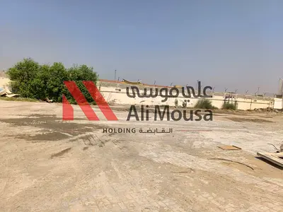 Spacious Open Yard for Rent – Ali Mousa Compound, Sajaa
