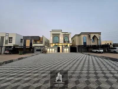 For sale: A villa on a main street with luxurious finishes, close to Sheikh Mohammed bin Zayed Road - Freehold for all nationalities for life - with e