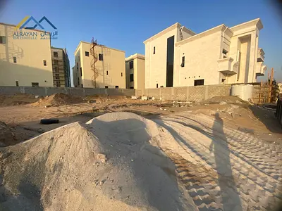 For sale, residential land \ in the most upscale area of ​​Ajman \ Al Alia area \ on an asphalt street \ very large setback in front of the villa *