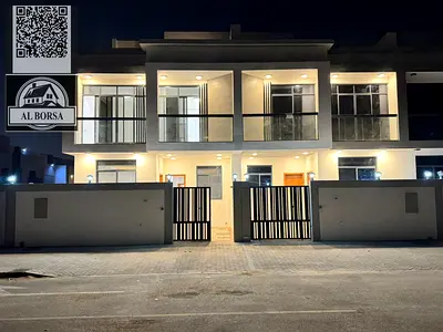 For sale in Al Bahia, a two-story townhouse with a roof terrace, featuring 6 master bedrooms, a living room, a majlis (formal sitting room), and a spa