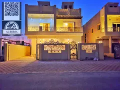 Villa for sale in Al Helio 2, Ajman. 5 bedrooms, majlis, living room, maid's room, and spacious 