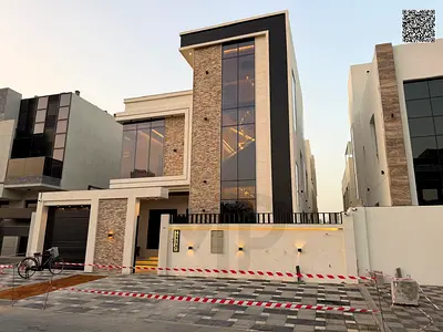 For sale: Modern villa in Al Yasmin, Ajman. Two floors + roof, 5 master bedrooms with a swimming pool, 4000 sq ft, freehold ownership for all national
