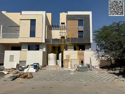 Distinctive villa for sale in Al Yasmeen on a 1,800 sqft land plot, consisting of two floors plus a rooftop, featuring a modern design and well-planne