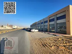 Al Amrah, Ajman – Commercial building for sale consisting of 4 shops and a mezzanine, located on A