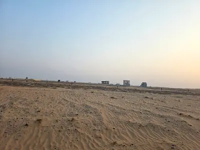 Two adjacent plots of land for sale in Sharjah, Al Balida area. One is a corner plot in Al Bataeh suburb.