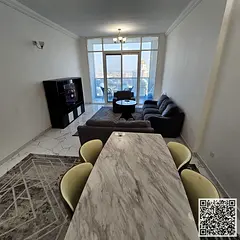 With an open view, a fully furnished two-bedroom apartment with a living room for monthly rent in Aj