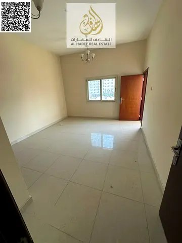 Two-bedroom apartment with a living room in Al Nuaimiya 1, next to Al Hikma School. Very spacious living room with built-in wardrobes. Excellent locat