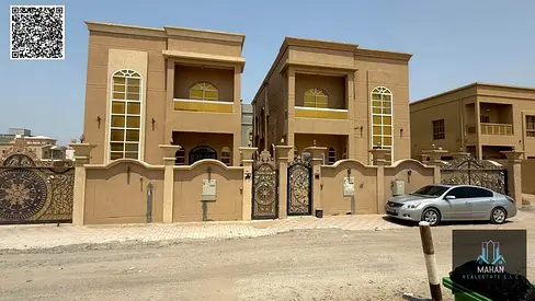 Modern villa for sale in Al Rawda 1 area, Ajman, including electricity, water, and air conditioning, facing a children's park.