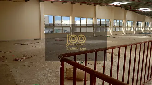 A fully integrated complex consisting of warehouses and shops, located on a main street.