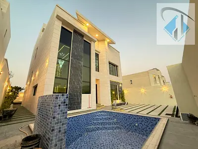 Villa with all registration, ownership, electricity, and water fees included, located on the main street, ready to move in, in one of Ajman's most pre