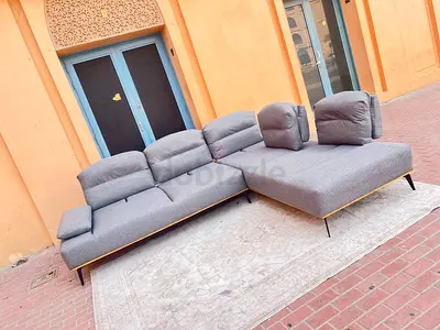 Like new Condition Home Center Limo 4_ Seater Sofa dark gray with adjustable head Rest