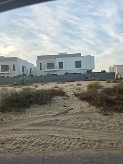 Two plots of land for sale in Sharjah, Al Hooshi area, Al Badi' suburb.