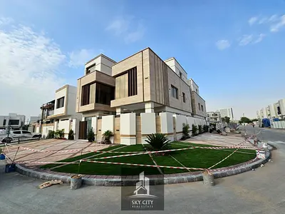 Luxury villa with a modern design, high-end finishes, a garden, a private pool, an elevator, and ce