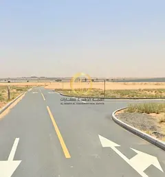 Residential land for sale in Rawdat Al-Qurt area, Al-Ruwaidat Suburb. Corner plot on two streets, 24