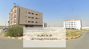 Prime commercial land for sale in Sharjah, Tilal City, ready for construction, permit for ground flo