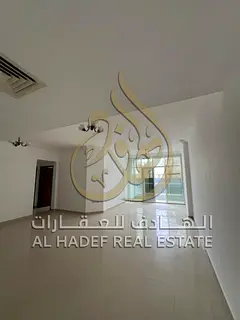 For rent in Sharjah, Al Taawun area: Two-bedroom apartment with living room, balcony, and maid's
