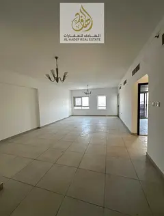 Two rooms and a hall, one of the largest apartments available for annual rent in Ajman, with parking