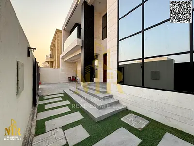 Corner villa behind Al Hamidiya Police Station in a strategic location, two floors and roof, 5 master bedrooms with elevator, price includes registrat