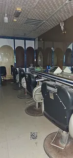 A men's salon shop is available for annual rent in Ajman, Al Rashidiya 2. The price is 42,000 AE