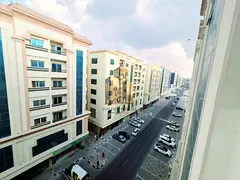 Lavish apartment with balcony cover parking 2 master room close to sharja airport road