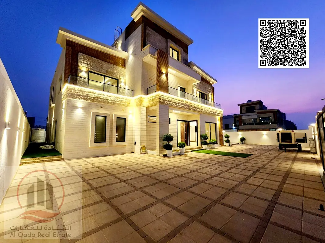 A corner villa for sale in Al Yasmeen, with an area of ​​​​8,100 square feet, consists of 8 master bedrooms, 2 living rooms, a maid's room, and a larg