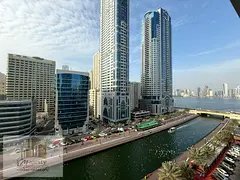 Luxury apartment for rent in Al Majaz 3 with a front view of Al Qasba Canal, spacious balconies, a s