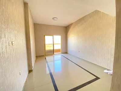 A building for sale in Ajman, a ground water area and 3 floors fully leased.