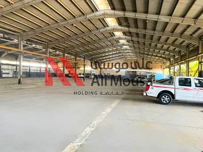 Premium Warehouse with Offices for Lease – Near Cement Factory, Sajaa High-Visibility Industrial Property – Ali Mousa Compound
