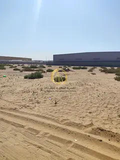 For sale: large corner plot in Al-Sajaa Industrial Area. Land area: 150,000 square feet. Excellent l